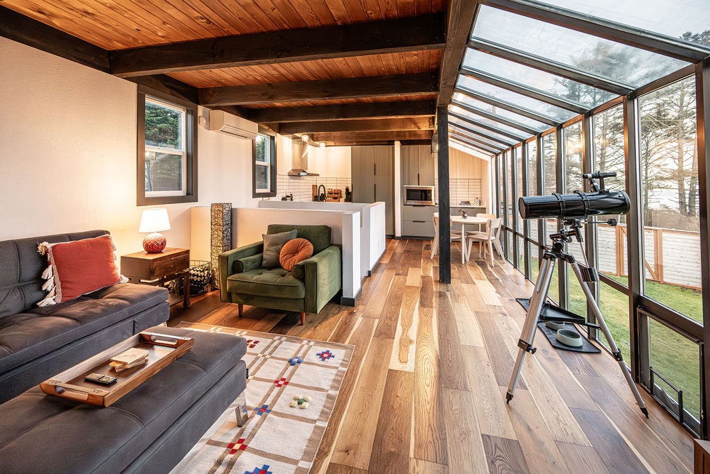 Ember sunroom wall of windows interior telescope sofa view